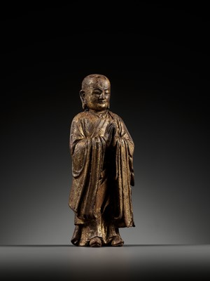 Lot 311 - A GILT-LACQUERED WOOD FIGURE OF ANANDA, YUAN TO MING DYNASTY