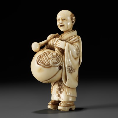 Lot 191 - MINKOKU: AN IVORY NETSUKE OF TEMPLE SERVANT WITH A MOKUGYO