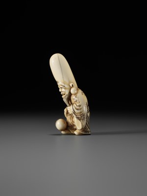 Lot 69 - AN OSAKA SCHOOL IVORY NETSUKE OF FUKUROKUJU PLAYING KEMARI