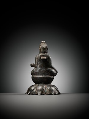 Lot 237 - A SILVERED COPPER-ALLOY FIGURE OF BUDDHA SHAKYAMUNI WITH SILVER-INLAID EYES, SWAT VALLEY, 7TH-8TH CENTURY