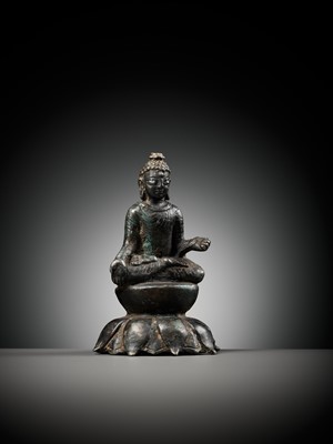 Lot 237 - A SILVERED COPPER-ALLOY FIGURE OF BUDDHA SHAKYAMUNI WITH SILVER-INLAID EYES, SWAT VALLEY, 7TH-8TH CENTURY