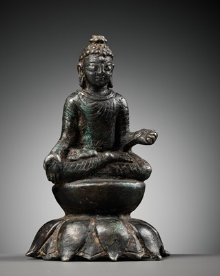 Lot 237 - A SILVERED COPPER-ALLOY FIGURE OF BUDDHA SHAKYAMUNI WITH SILVER-INLAID EYES, SWAT VALLEY, 7TH-8TH CENTURY