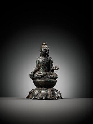 Lot 237 - A SILVERED COPPER-ALLOY FIGURE OF BUDDHA SHAKYAMUNI WITH SILVER-INLAID EYES, SWAT VALLEY, 7TH-8TH CENTURY