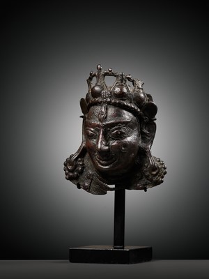 Lot 255 - A SMALL BRONZE PROCESSIONAL MASK OF SHIVA MAHADEVA WITH INLAID PUPILS, 12TH-13TH CENTURY
