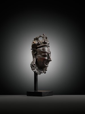 Lot 255 - A SMALL BRONZE PROCESSIONAL MASK OF SHIVA MAHADEVA WITH INLAID PUPILS, 12TH-13TH CENTURY