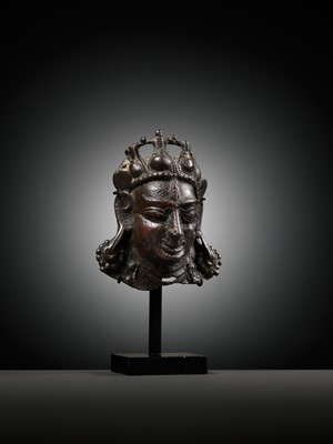 Lot 255 - A SMALL BRONZE PROCESSIONAL MASK OF SHIVA MAHADEVA WITH INLAID PUPILS, 12TH-13TH CENTURY