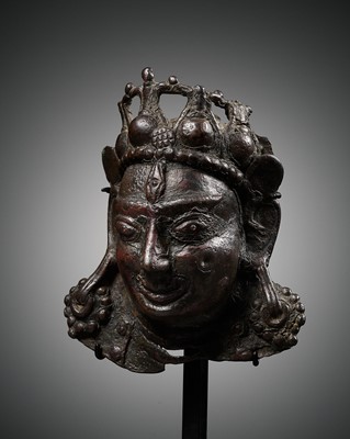 Lot 255 - A SMALL BRONZE PROCESSIONAL MASK OF SHIVA MAHADEVA WITH INLAID PUPILS, 12TH-13TH CENTURY