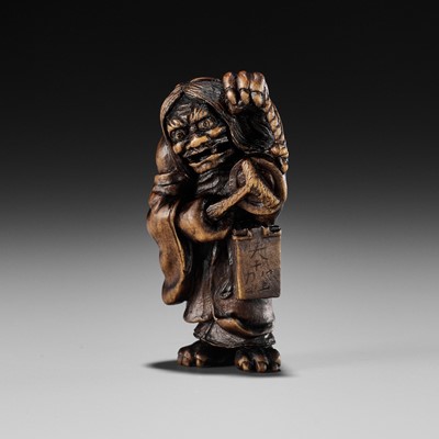 Lot 541 - ALEXANDER DERKACHENKO: A BOXWOOD NETSUKE OF ONI NO NEMBUTSU