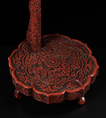 Lot 63 - A FINE TSUISHU (CARVED RED LACQUER) TACHI KAKE (STAND FOR A TACHI SWORD)