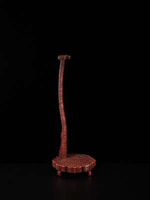Lot 63 - A FINE TSUISHU (CARVED RED LACQUER) TACHI KAKE (STAND FOR A TACHI SWORD)
