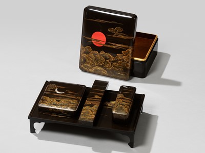 A MAGNIFICENT LACQUER WRITING SET WITH THE RISING SUN, CRESCENT MOON AND CLOUDS