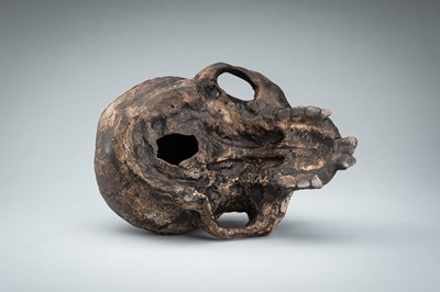 Lot 255 - A LIFESIZE CERAMIC MEMENTO MORI OF A SKULL WITH A SNAKE
