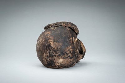 Lot 255 - A LIFESIZE CERAMIC MEMENTO MORI OF A SKULL WITH A SNAKE