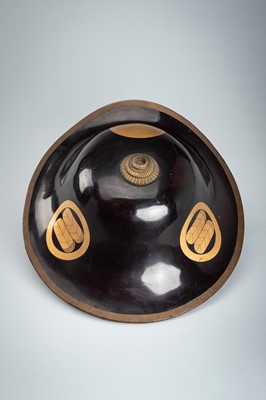 Lot 79 - A LACQUERED JINGASA (WAR HAT) WITH TAKANOHA MON