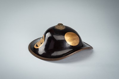 Lot 79 - A LACQUERED JINGASA (WAR HAT) WITH TAKANOHA MON