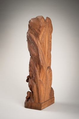 A WOOD CARVING OF CARP IN A WATERFALL