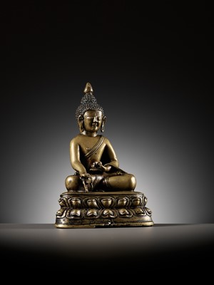 AN INLAID BRONZE FIGURE OF BUDDHA, TIBET, 13TH-14TH CENTURY