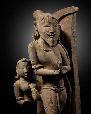 Lot 243 - A GRAY SANDSTONE RELIEF DEPICTING A KING, CHANDELA DYNASTY, CENTRAL INDIA, KHAJURAHO, 10TH-11TH CENTURY