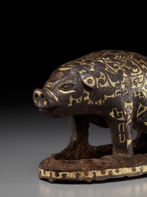 Lot 66 - A GOLD AND SILVER-INLAID IRON FIGURE OF A PIG, WARRING STATES PERIOD TO HAN DYNASTY