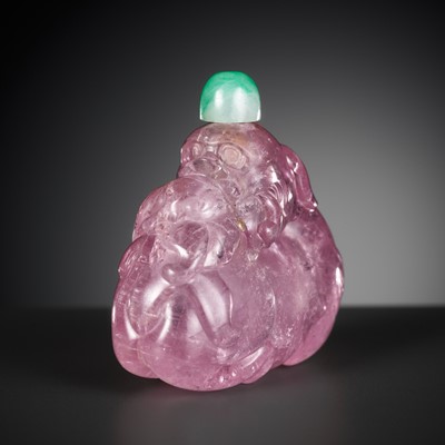 Lot 471 - A PINK TOURMALINE ‘BUDDHIST LION AND LINGZHI’ SNUFF BOTTLE, 18TH-19TH CENTURY