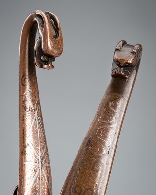 Lot 1004 - A GROUP OF TWO SILVER-INLAID BRONZE BELT HOOKS, 17TH CENTURY