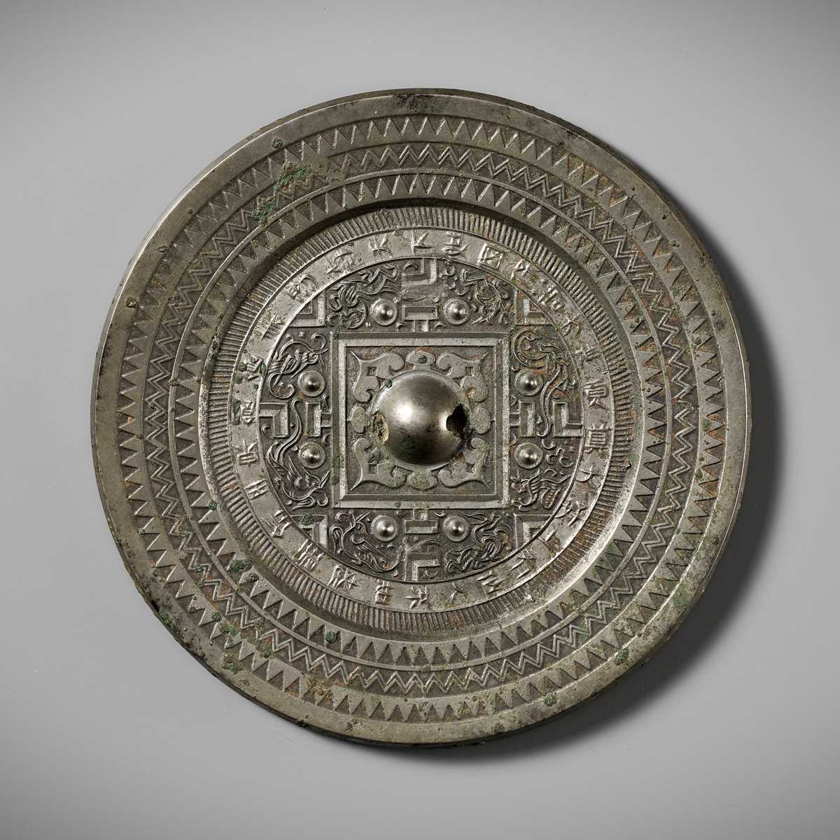 Lot 75 - AN INSCRIBED SILVERY BRONZE ‘TLV’ MIRROR, WESTERN HAN DYNASTY