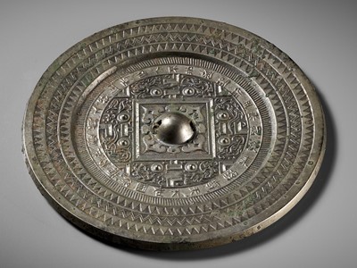 Lot 75 - AN INSCRIBED SILVERY BRONZE ‘TLV’ MIRROR, WESTERN HAN DYNASTY