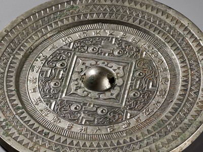 Lot 75 - AN INSCRIBED SILVERY BRONZE ‘TLV’ MIRROR, WESTERN HAN DYNASTY