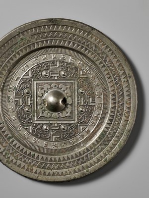 Lot 75 - AN INSCRIBED SILVERY BRONZE ‘TLV’ MIRROR, WESTERN HAN DYNASTY