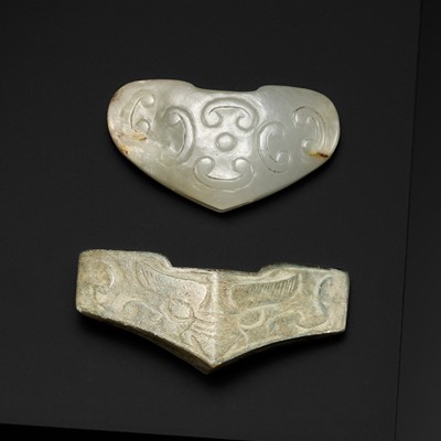 Lot 1737 - TWO ARCHAIC CELADON JADE SWORD GUARDS, WARRING STATES PERIOD TO HAN DYNASTY