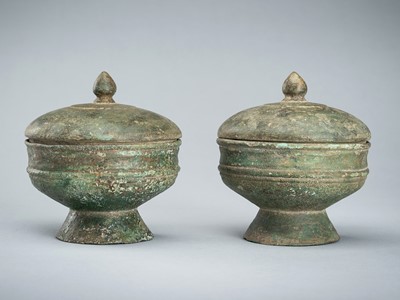 Lot 1392 - A PAIR OF BRONZE MEDICINE VESSELS AND COVERS, ANGKOR PERIOD, 12TH-13TH CENTURY