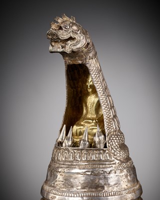 Lot 162 - A REPOUSSÉ SILVER ‘NAGA’ RELIQUARY CONTAINING A SMALL GOLD BUDDHA, BURMA, 18TH-19TH CENTURY