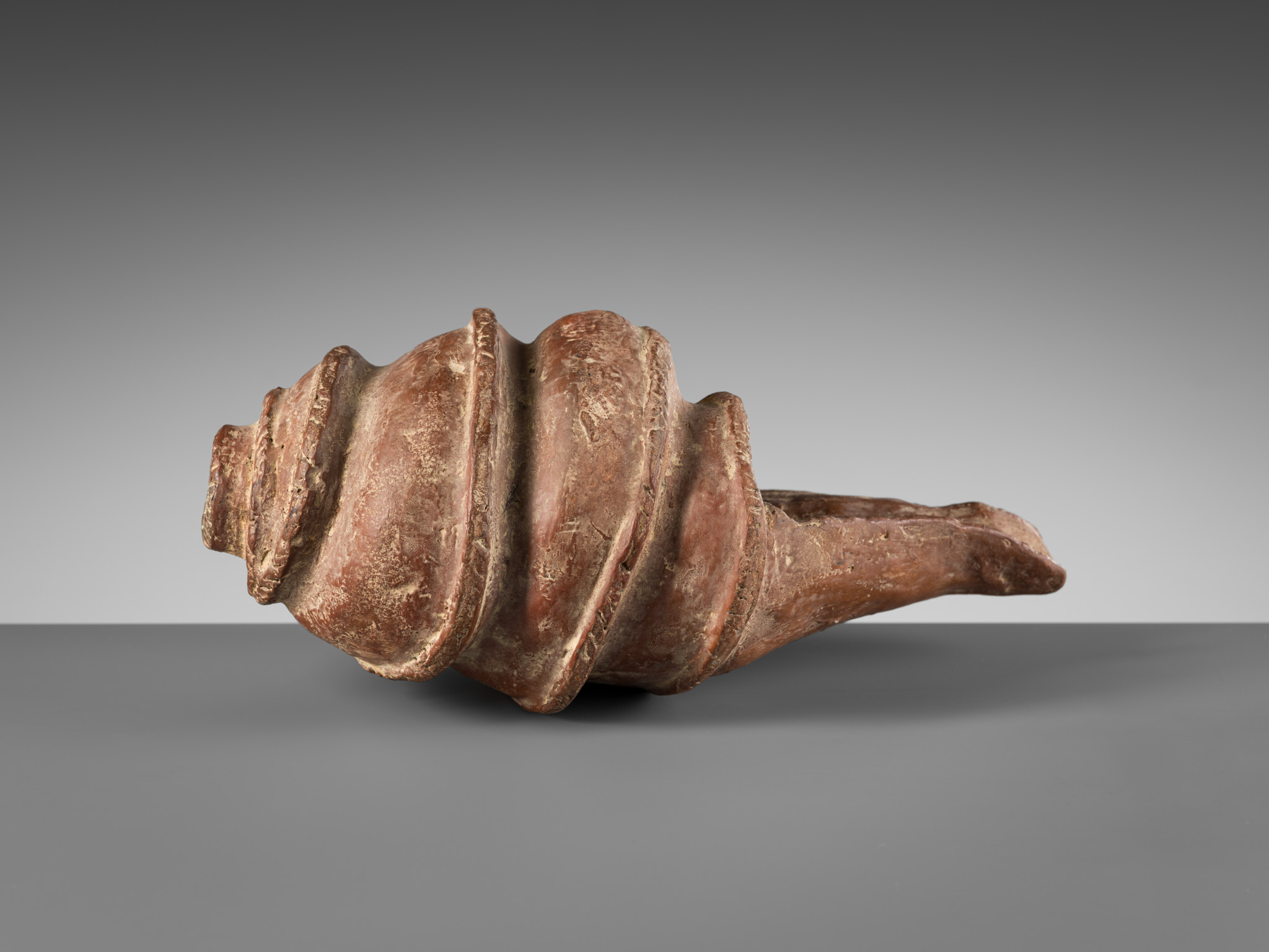 Lot 595 - A RARE POTTERY CONCH SHELL, ANGKOR PERIOD