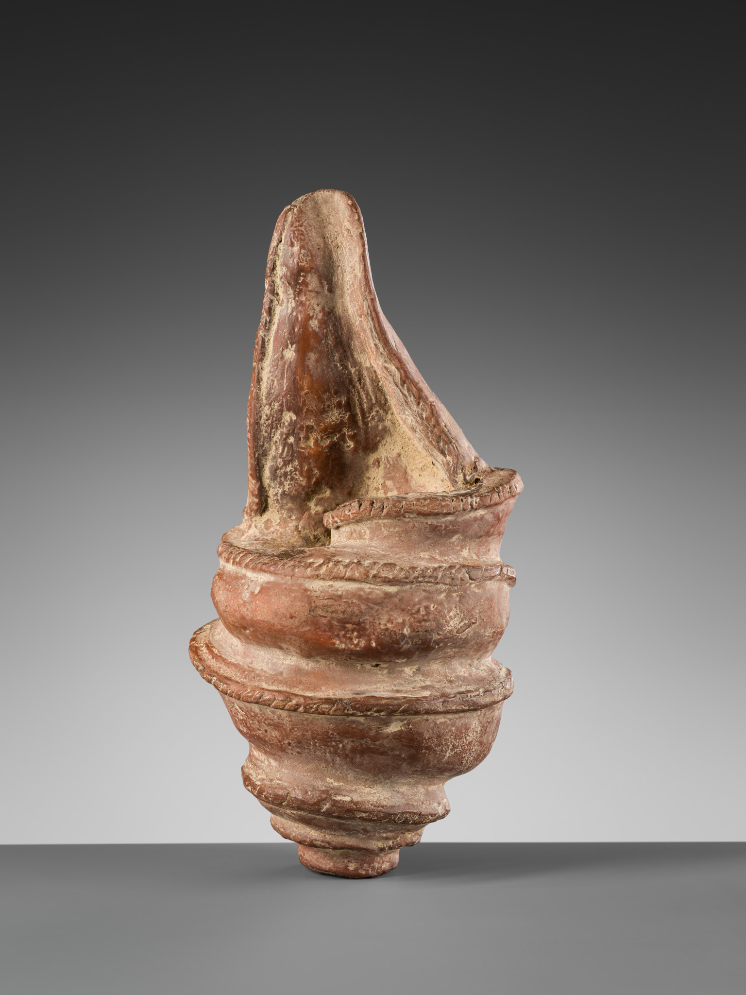 Lot 595 - A RARE POTTERY CONCH SHELL, ANGKOR PERIOD