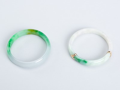 Lot 905 - A GROUP OF TWO JADEITE BANGLES