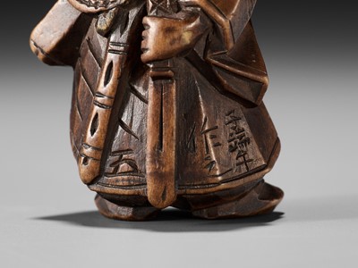 Lot 369 - A FINE ITTOBORI WOOD NETSUKE OF SHOKI, CARVED FOR THE TANGO-NO-SEKKU FESTIVAL