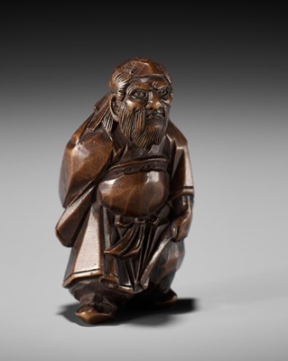 Lot 369 - A FINE ITTOBORI WOOD NETSUKE OF SHOKI, CARVED FOR THE TANGO-NO-SEKKU FESTIVAL