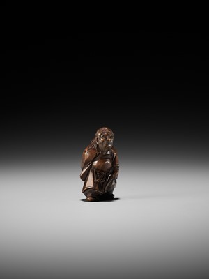 Lot 369 - A FINE ITTOBORI WOOD NETSUKE OF SHOKI, CARVED FOR THE TANGO-NO-SEKKU FESTIVAL