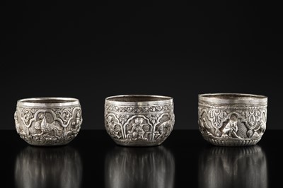 Lot 1520 - A LOT WITH THREE EMBOSSED BURMESE SILVER BOWLS, c. 1900s