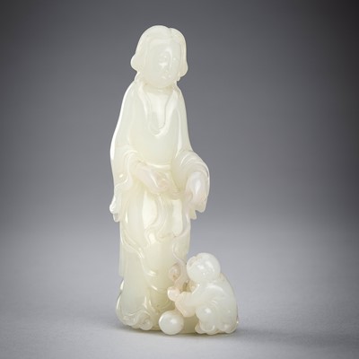 Lot 897 - A PALE CELADON JADE GROUP OF A FEMALE IMMORTAL AND BOY, c. 1920s