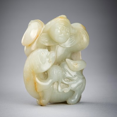 Lot 876 - A CELADON JADE CARVING OF A FOREIGNER WITH A BUDDHIST LION, QING DYNASTY
