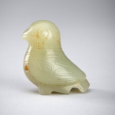 Lot 810 - A PALE CELADON JADE ‘BIRD’ PENDANT, SHANG DYNASTY OR LATER