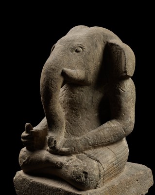 Lot 180 - A RARE AND MASSIVE KHMER SANDSTONE FIGURE OF GANESHA, PRE-ANGKOR, 7TH TO 9TH CENTURY