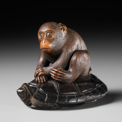 Lot 385 - AN AMUSING BOXWOOD AND EBONY OKIMONO OF A MONKEY RIDING A TORTOISE