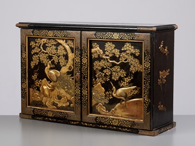 Lot 43 - A SUPERB AND LARGE LACQUER CABINET DEPICTING KUJAKU (PEACOCKS) AND SAKURA (CHERRY) BLOSSOMS