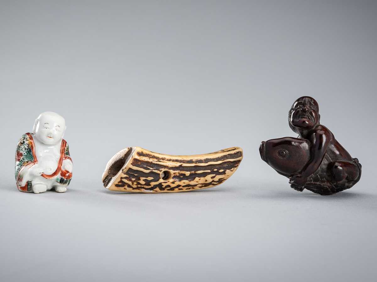 Lot 445 - A GROUP OF THREE NETSUKE
