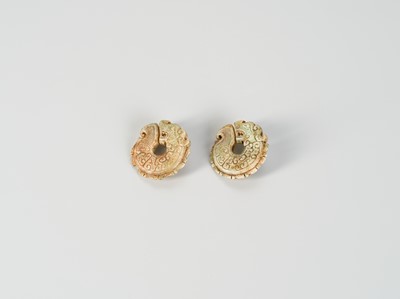 A PAIR OF ARCHAISTIC ‘DRAGON’ PENDANTS, QING OR EARLIER