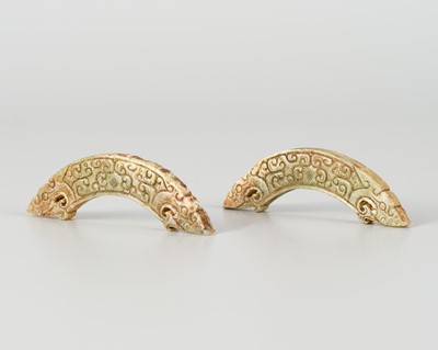 A PAIR OF ARCHAISTIC 'DOUBLE-DRAGON' PENDANTS, HUANG, QING OR EARLIER
