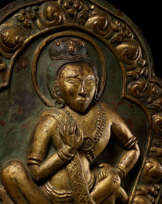 Lot 5 - A LARGE PARCEL-GILT COPPER REPOUSSÉ PLAQUE DEPICTING THE MAHASIDDHA NAROPA, TIBET, 18TH - 19TH CENTURY
