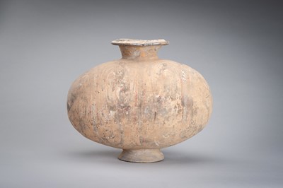 Lot 1172 - AN ABSTRACTLY PAINTED POTTERY COCOON JAR, HAN DYNASTY
